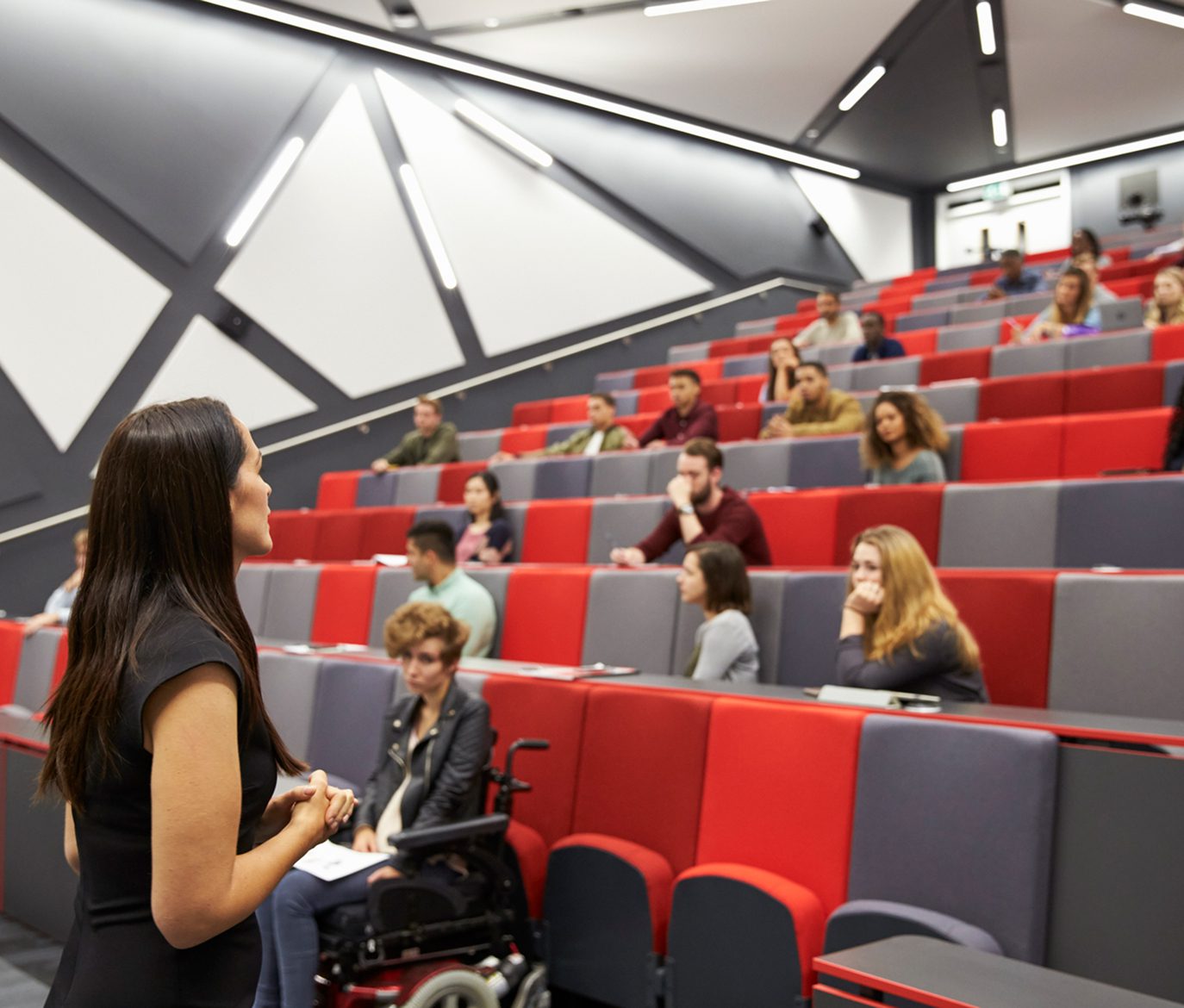 Professor teaching students in lecture hall