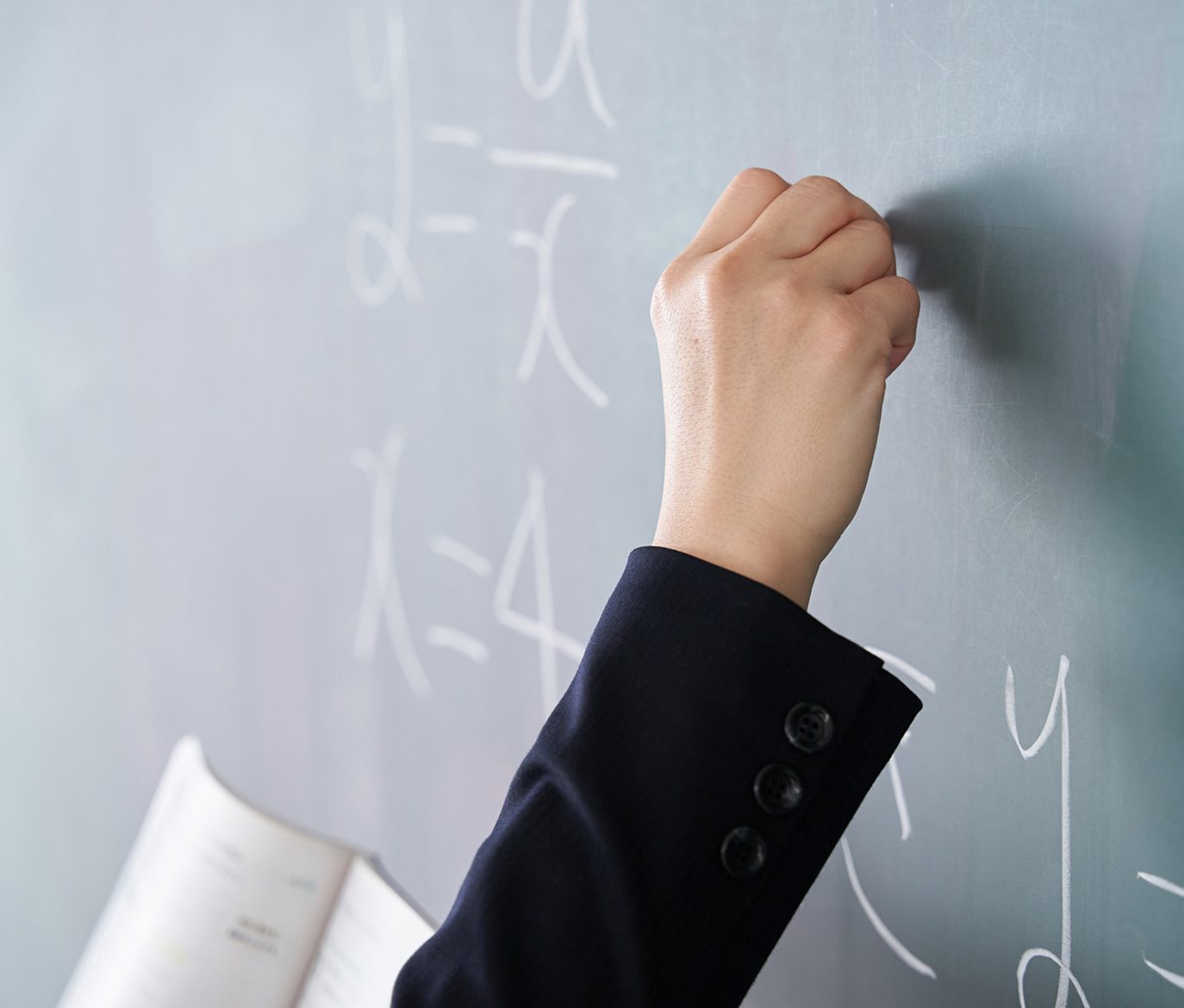 Writing equations on chalkboard